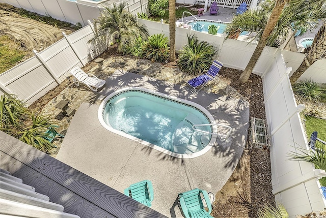 113-A Vista Dr, Garden City Beach, SC 29576 - view of pool with a jacuzzi and a fenced backyard
