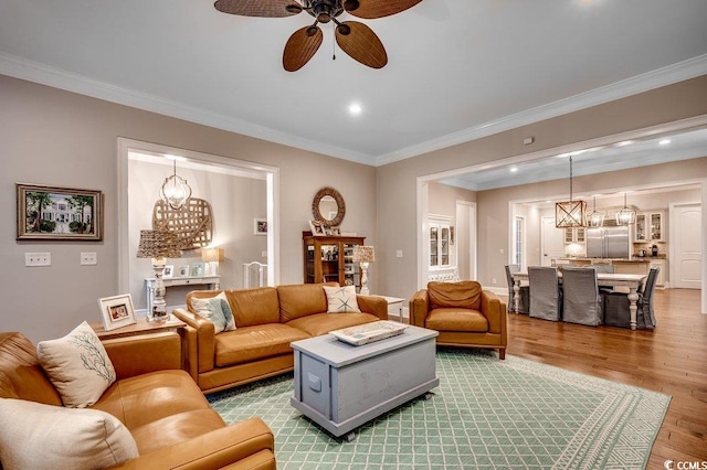 9 Winnowing Way, Pawleys Island, SC 29585 - living room with a chandelier, wood finished floors, a ceiling fan, ornamental molding, and recessed lighting