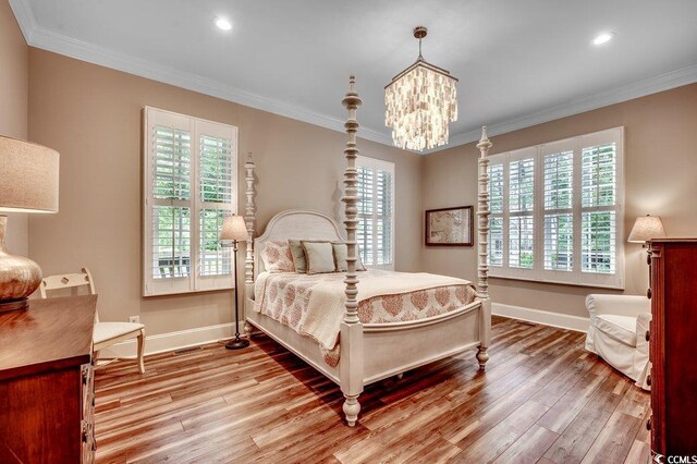 9 Winnowing Way, Pawleys Island, SC 29585 - bedroom featuring light wood-type flooring, crown molding, baseboards, a chandelier, and recessed lighting