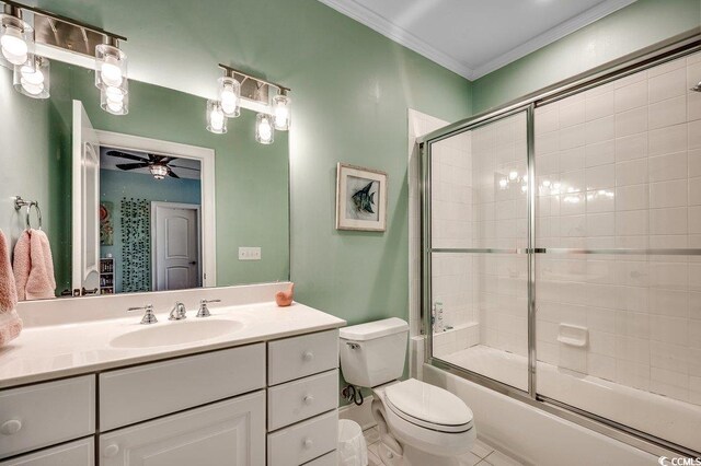 9 Winnowing Way, Pawleys Island, SC 29585 - bathroom with toilet, vanity, ceiling fan, crown molding, and enclosed tub / shower combo