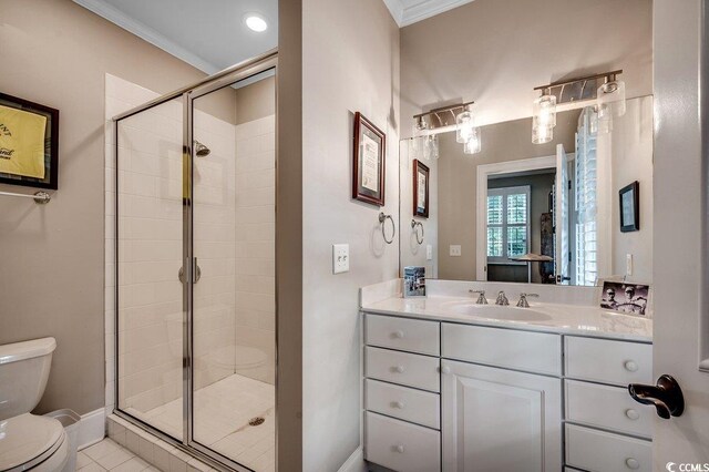 9 Winnowing Way, Pawleys Island, SC 29585 - bathroom with toilet, a shower stall, crown molding, vanity, and baseboards