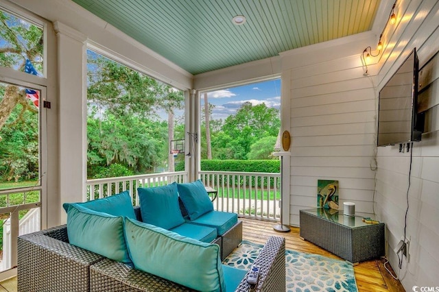 9 Winnowing Way, Pawleys Island, SC 29585 - sunroom / solarium featuring an outdoor hangout area, plenty of natural light, and view of wooded area