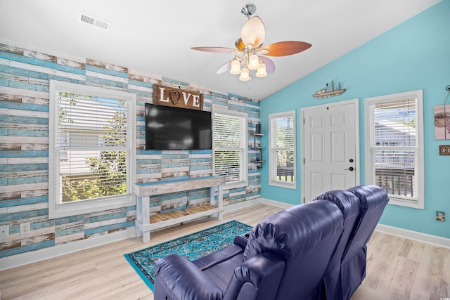 739 Tall Oaks Dr, Myrtle Beach, SC 29588 - living area with baseboards, lofted ceiling, a ceiling fan, plenty of natural light, and wood finished floors