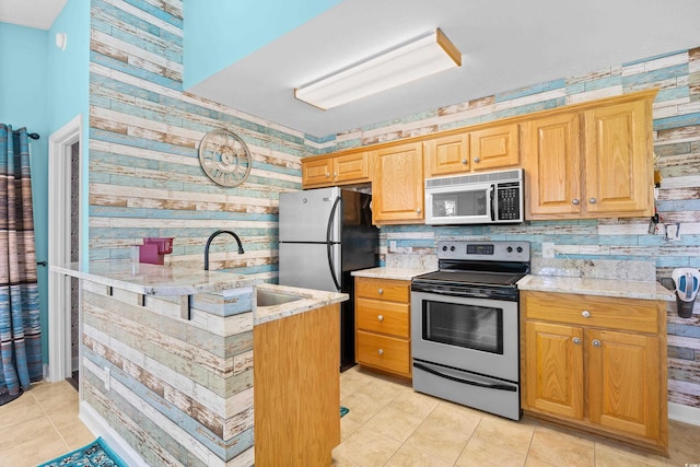 739 Tall Oaks Dr, Myrtle Beach, SC 29588 - kitchen with stainless steel appliances, light tile patterned flooring, a sink, light stone countertops, and backsplash