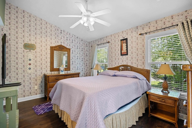 739 Tall Oaks Dr, Myrtle Beach, SC 29588 - bedroom featuring dark wood-style flooring, wallpapered walls, baseboards, and a ceiling fan