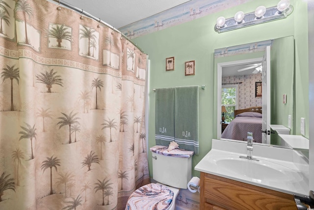 739 Tall Oaks Dr, Myrtle Beach, SC 29588 - ensuite bathroom featuring vanity, toilet, wallpapered walls, and curtained shower