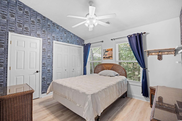 739 Tall Oaks Dr, Myrtle Beach, SC 29588 - bedroom featuring light wood-type flooring, lofted ceiling, baseboards, wallpapered walls, and a ceiling fan