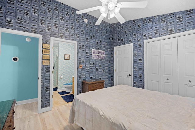 739 Tall Oaks Dr, Myrtle Beach, SC 29588 - bedroom with wood finished floors, a ceiling fan, baseboards, and connected bathroom