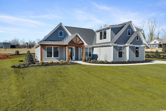 2729 Long Ave, Conway, SC 29526 - view of front of house featuring a front yard, board and batten siding, and a porch