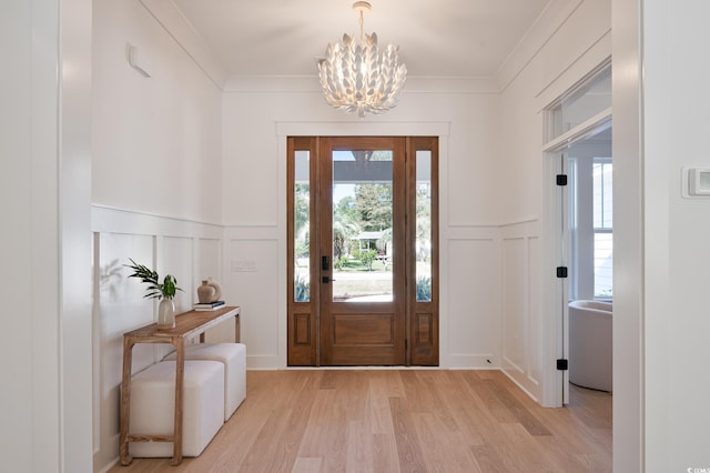 2729 Long Ave, Conway, SC 29526 - entryway featuring a decorative wall, a chandelier, light wood-type flooring, wainscoting, and ornamental molding