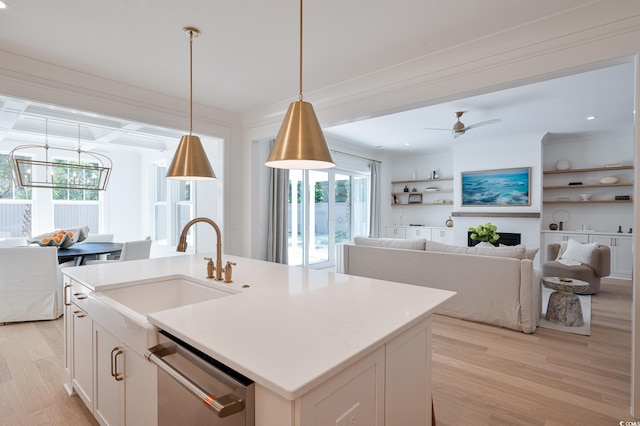 2729 Long Ave, Conway, SC 29526 - kitchen with stainless steel dishwasher, light wood finished floors, a ceiling fan, a sink, and decorative light fixtures