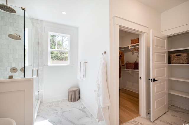 2729 Long Ave, Conway, SC 29526 - bathroom featuring marble look tile flooring, a spacious closet, a stall shower, recessed lighting, and baseboards