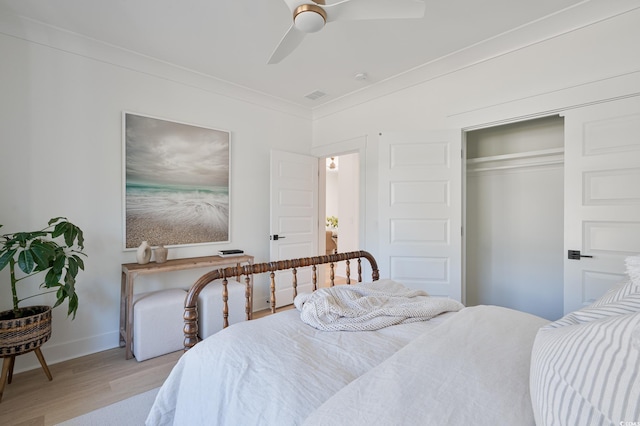 2729 Long Ave, Conway, SC 29526 - bedroom with light wood-style floors, crown molding, baseboards, a closet, and a ceiling fan