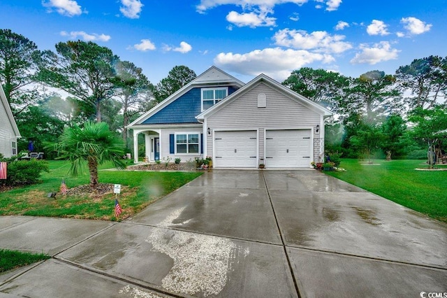 3091 Viceroy Loop, Little River, SC 29566 - view of front of house featuring concrete driveway, a front yard, and an attached garage