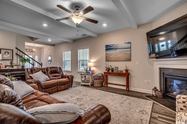 3091 Viceroy Loop, Little River, SC 29566 - living area featuring beam ceiling, a fireplace with flush hearth, stairs, wood finished floors, and baseboards