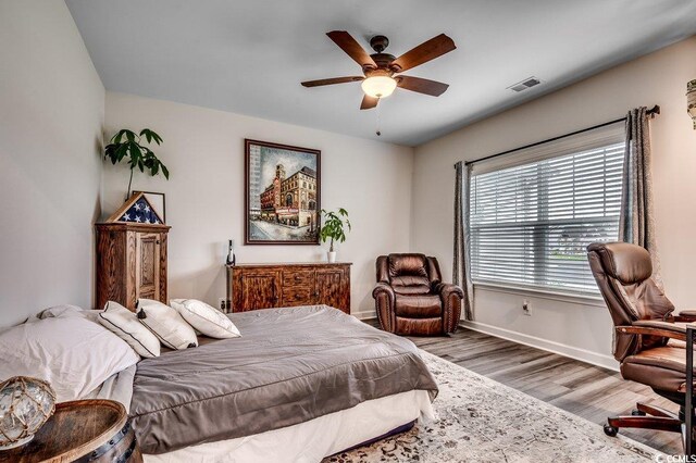 3091 Viceroy Loop, Little River, SC 29566 - bedroom with baseboards, wood finished floors, and a ceiling fan