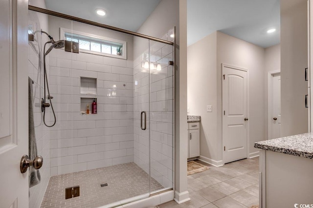 3091 Viceroy Loop, Little River, SC 29566 - bathroom with vanity, a shower stall, tile patterned floors, baseboards, and recessed lighting