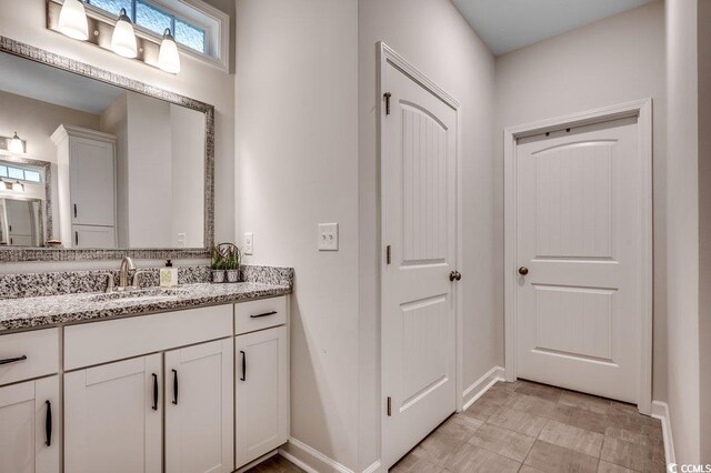 3091 Viceroy Loop, Little River, SC 29566 - bathroom with vanity and baseboards