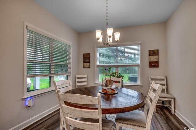 3091 Viceroy Loop, Little River, SC 29566 - dining area featuring dark wood-style flooring, baseboards, plenty of natural light, and a chandelier