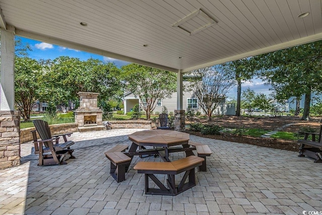 3091 Viceroy Loop, Little River, SC 29566 - view of patio / terrace featuring an outdoor stone fireplace and outdoor dining space