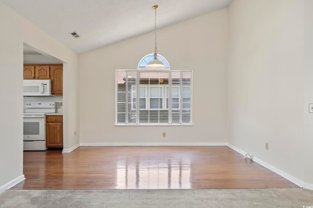 914 Dock Pl, Murrells Inlet, SC 29576 - unfurnished dining area featuring lofted ceiling, wood finished floors, and baseboards