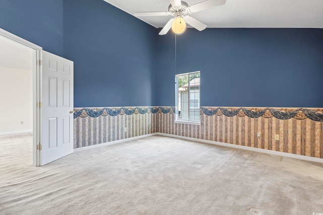 914 Dock Pl, Murrells Inlet, SC 29576 - carpeted spare room featuring high vaulted ceiling, ceiling fan, and a wainscoted wall