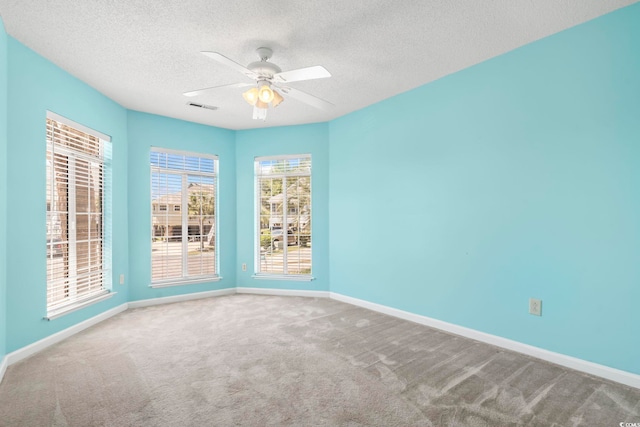 914 Dock Pl, Murrells Inlet, SC 29576 - spare room with carpet floors, a textured ceiling, baseboards, and a ceiling fan