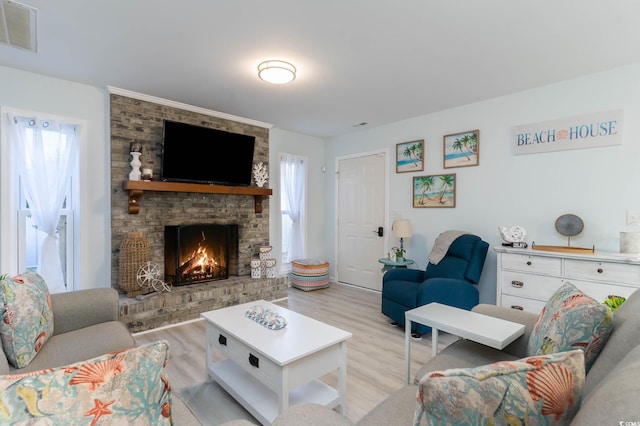 4307 Beverly Ct, North Myrtle Beach, SC 29582 - living area featuring a fireplace and light wood-style floors