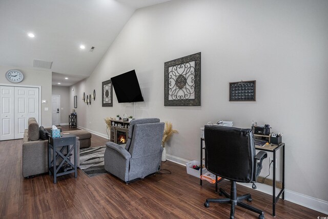 2472 Bayboro St Unit C, Loris, SC 29569 - living area featuring wood finished floors, high vaulted ceiling, baseboards, recessed lighting, and a glass covered fireplace