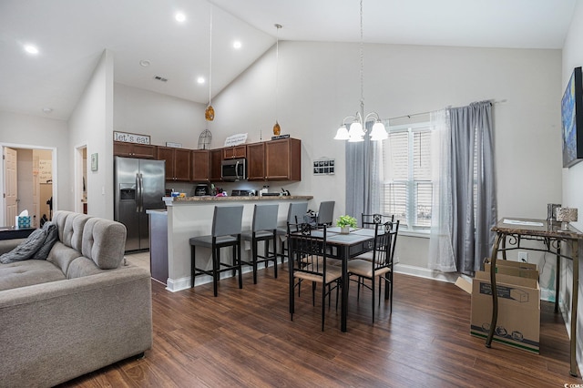 2472 Bayboro St Unit C, Loris, SC 29569 - dining room with high vaulted ceiling, a chandelier, dark wood-style flooring, and baseboards