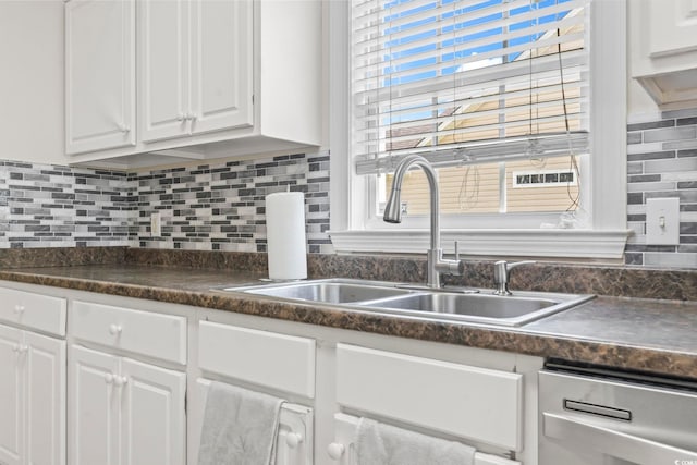176 Whispering Oaks Dr, Longs, SC 29568 - kitchen featuring a sink, white cabinets, dark countertops, and tasteful backsplash