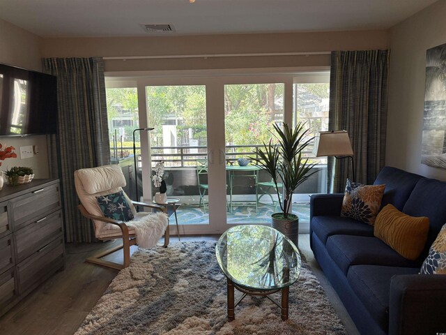 415 Ocean Creek Dr Unit 2117, Myrtle Beach, SC 29572 - living area with healthy amount of natural light and wood finished floors