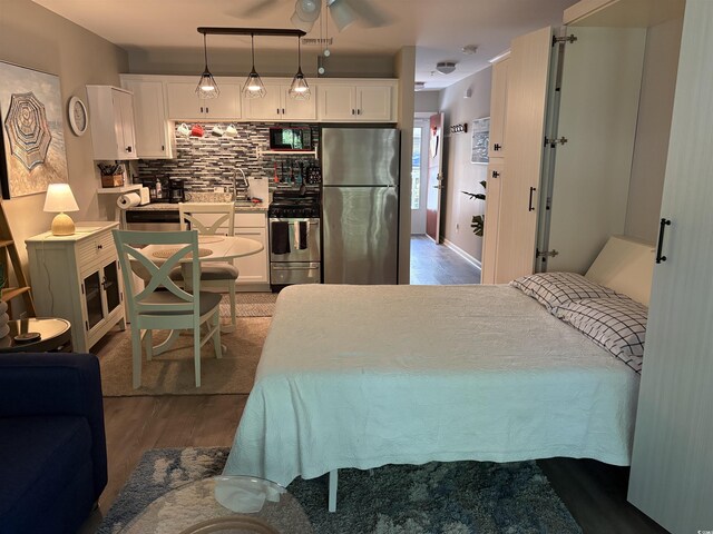 415 Ocean Creek Dr Unit 2117, Myrtle Beach, SC 29572 - bedroom featuring freestanding refrigerator and wood finished floors