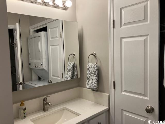 415 Ocean Creek Dr Unit 2117, Myrtle Beach, SC 29572 - bathroom with stacked washer / dryer and vanity