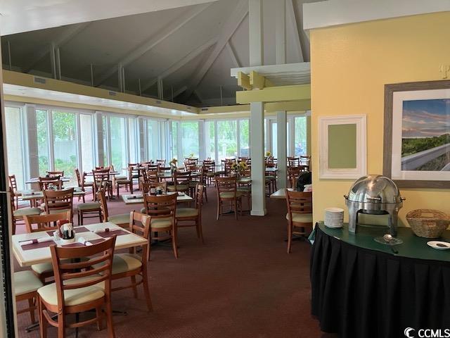 415 Ocean Creek Dr Unit 2117, Myrtle Beach, SC 29572 - carpeted dining room with high vaulted ceiling