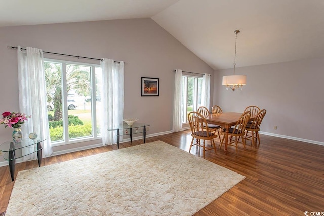 18 Pine Valley Ln, Surfside Beach, SC 29575 - dining space featuring a chandelier, high vaulted ceiling, dark wood finished floors, and baseboards