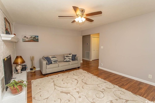 18 Pine Valley Ln, Surfside Beach, SC 29575 - living area featuring ceiling fan, wood finished floors, baseboards, and a brick fireplace