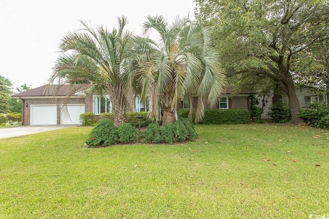 18 Pine Valley Ln, Surfside Beach, SC 29575 - obstructed view of property with concrete driveway, a garage, a front yard, and brick siding
