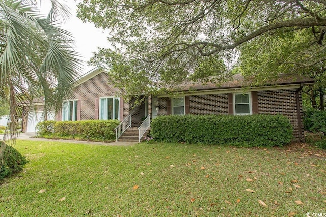 18 Pine Valley Ln, Surfside Beach, SC 29575 - view of front of house featuring brick siding and a front lawn
