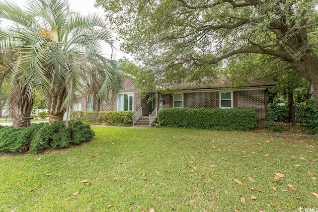 18 Pine Valley Ln, Surfside Beach, SC 29575 - view of front of property with a front lawn and brick siding