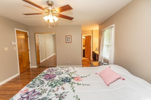 18 Pine Valley Ln, Surfside Beach, SC 29575 - bedroom featuring wood finished floors, a ceiling fan, baseboards, and a closet