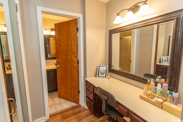 18 Pine Valley Ln, Surfside Beach, SC 29575 - bathroom featuring wood finished floors, vanity, and a shower