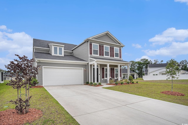 3129 Palma Way, Myrtle Beach, SC 29579 - traditional home with covered porch, driveway, a front yard, and an attached garage
