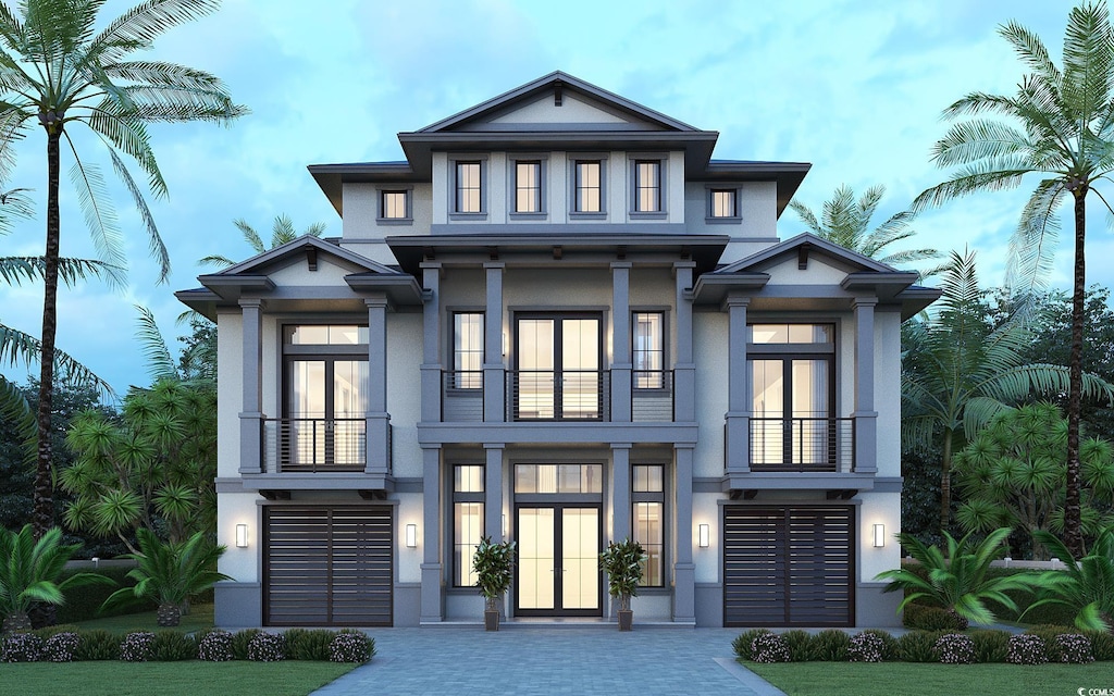 852 Waterton Ave, Myrtle Beach, SC 29579 - view of front facade with a balcony, stucco siding, decorative driveway, and an attached garage