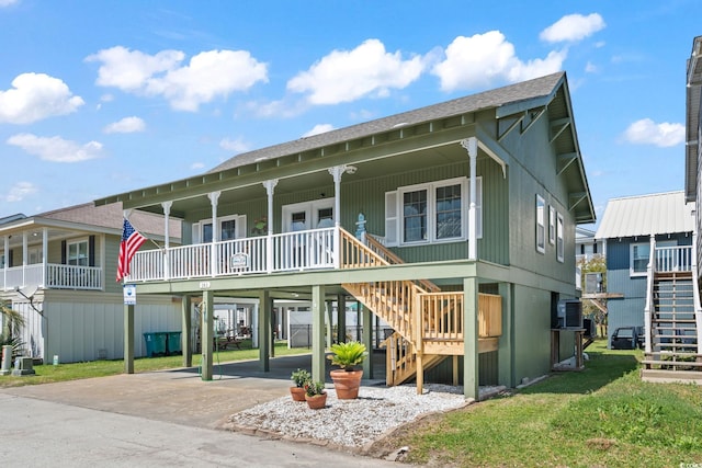 161 Easy St, Garden City Beach, SC 29576 - view of front of house with stairway, concrete driveway, a carport, roof with shingles, and covered porch