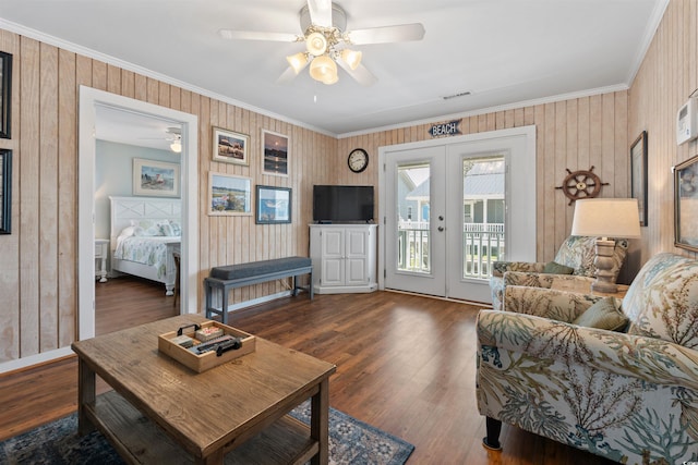 161 Easy St, Garden City Beach, SC 29576 - living area featuring ornamental molding, a ceiling fan, french doors, wood finished floors, and wooden walls