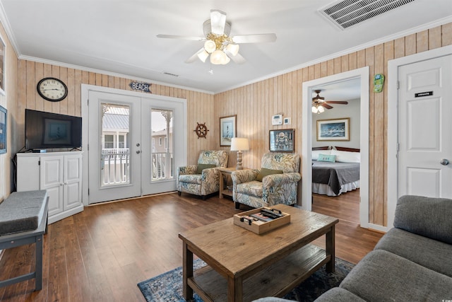 161 Easy St, Garden City Beach, SC 29576 - living area with crown molding, french doors, a ceiling fan, wood finished floors, and wooden walls