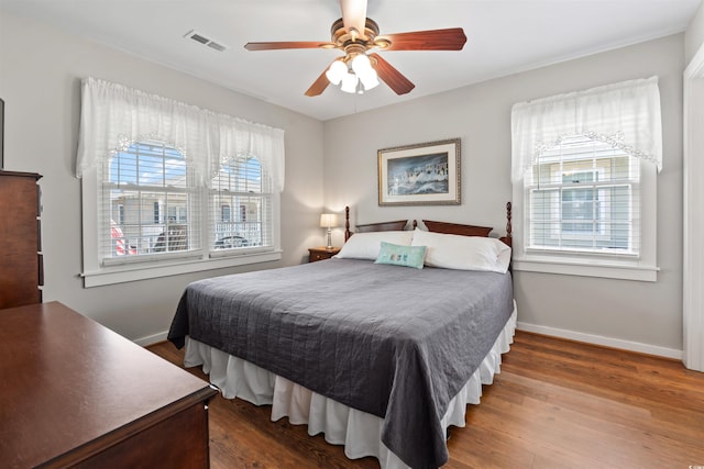 161 Easy St, Garden City Beach, SC 29576 - bedroom with wood finished floors, baseboards, and a ceiling fan