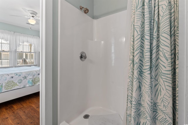 161 Easy St, Garden City Beach, SC 29576 - ensuite bathroom featuring curtained shower, wood finished floors, and ceiling fan