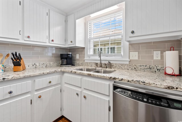 161 Easy St, Garden City Beach, SC 29576 - kitchen with stainless steel dishwasher, a sink, backsplash, and white cabinetry